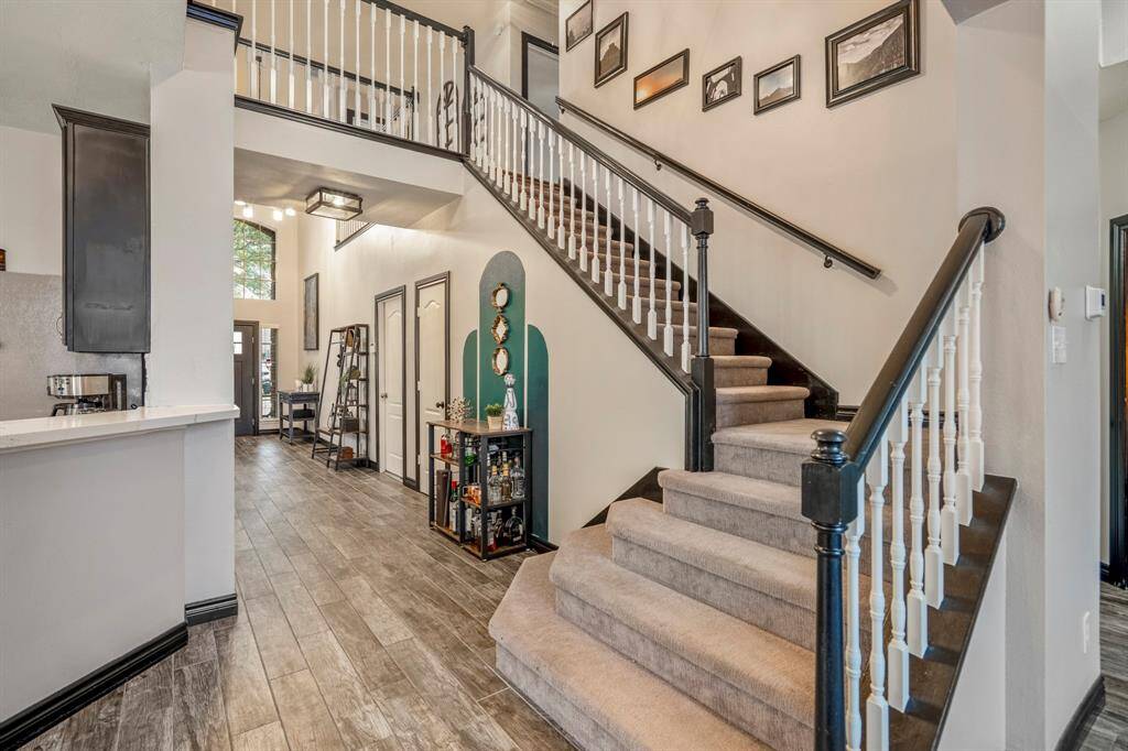 Now let’s head upstairs—where the fun begins in your very own game room! It’s the perfect space for movie nights, game days, or just hanging out. Bonus: it’s the only area in the home with carpet, adding a cozy touch to all the action.