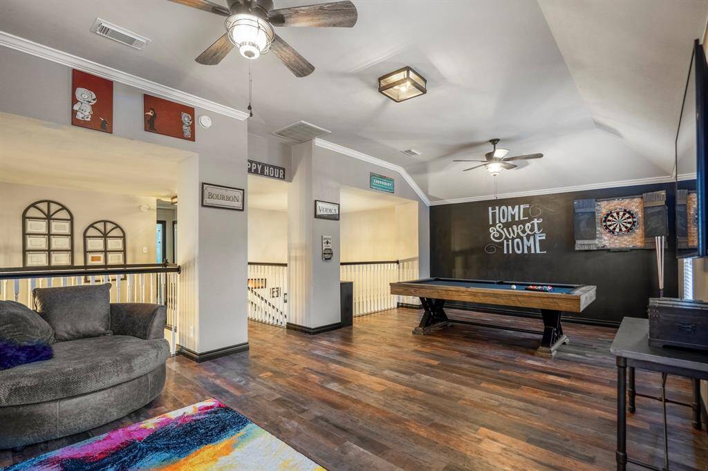 This expansive game room offers endless possibilities—whether it’s a friendly game of pool, a round of darts, or a relaxed movie night, there’s room for it all.