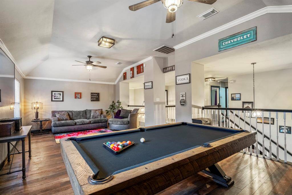 This expansive game room offers endless possibilities—whether it’s a friendly game of pool, a round of darts, or a relaxed movie night, there’s room for it all.