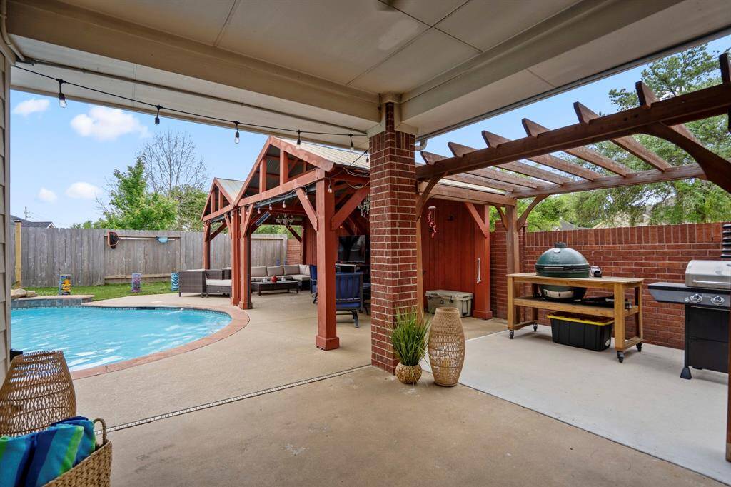 This is where the fun begins—your own private backyard oasis! Dive into the heated pool, relax in the hot tub, or unwind under the covered pergolas equipped with electricity. Practice your short game on the putting green, and enjoy the low-maintenance lifestyle with lush astro turf that keeps things looking pristine year-round.