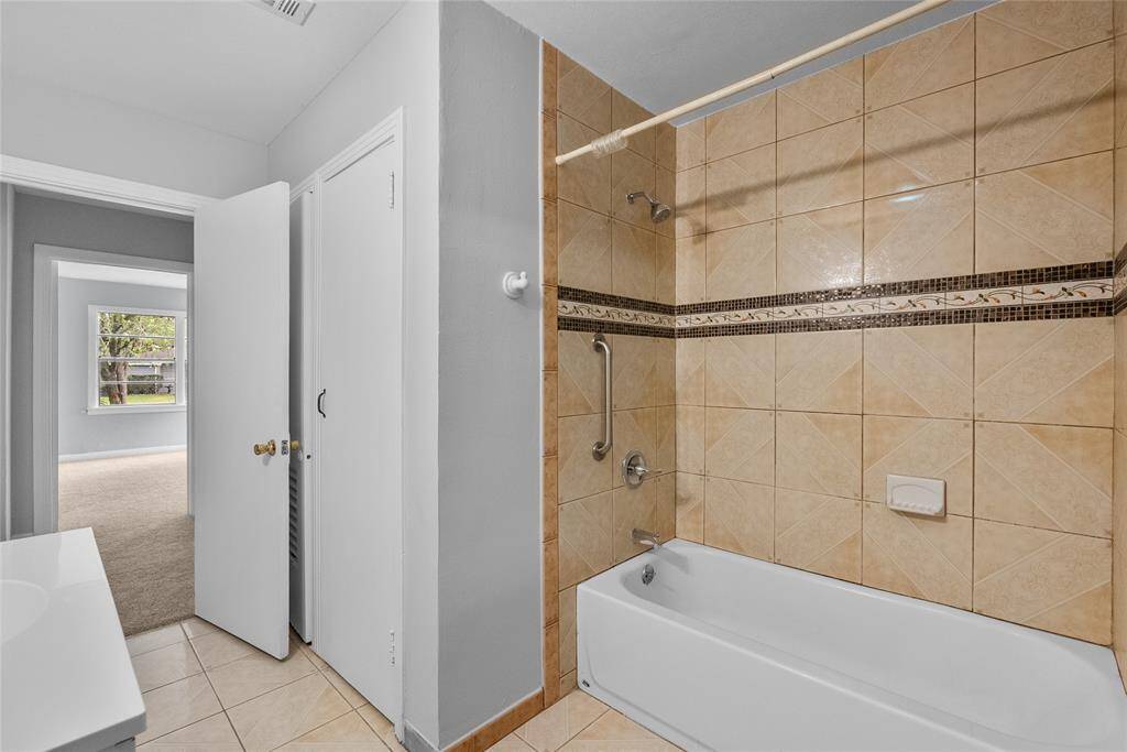 Full bath with linen closet.