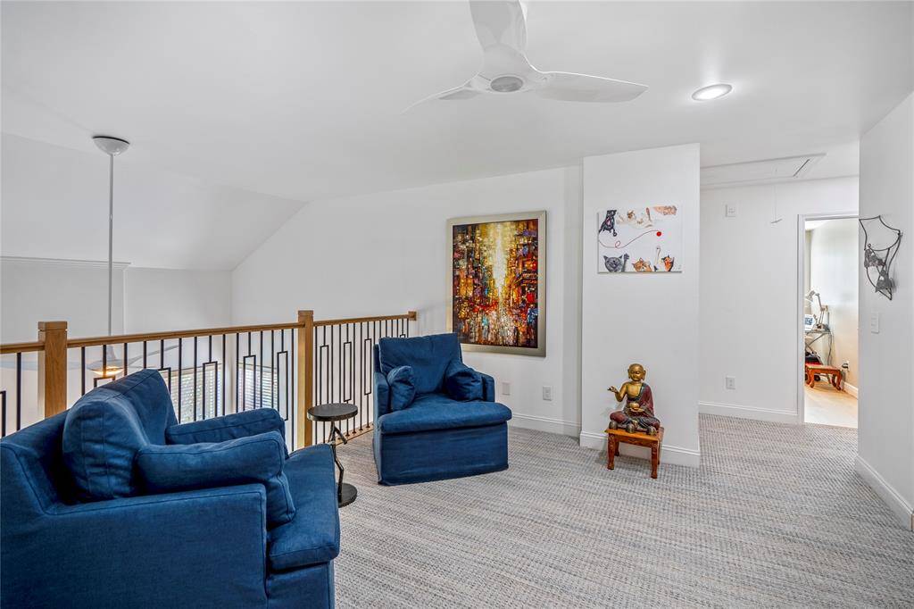 With its open design, the loft creates a seamless connection to the main living areas, allowing natural light to flow throughout the home while maintaining a sense of spaciousness and sophistication.
