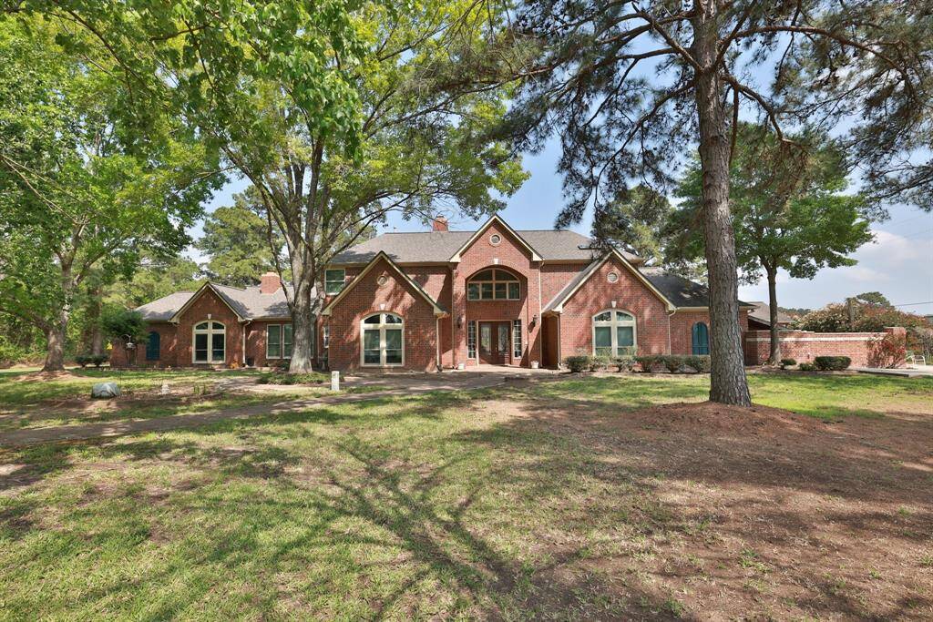 The home sits on 18018 Cypress Rosehill and the additional 4 acres behind are 17944 Cypress Rosehill.