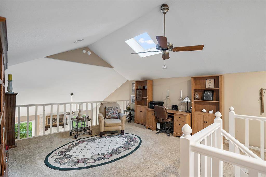 Let's venture upstairs to view this charming loft space! The traditional style staircase allows the light to beam across the space! This room is currently being used as a TV viewing space, but would be the perfect home office or reading room!