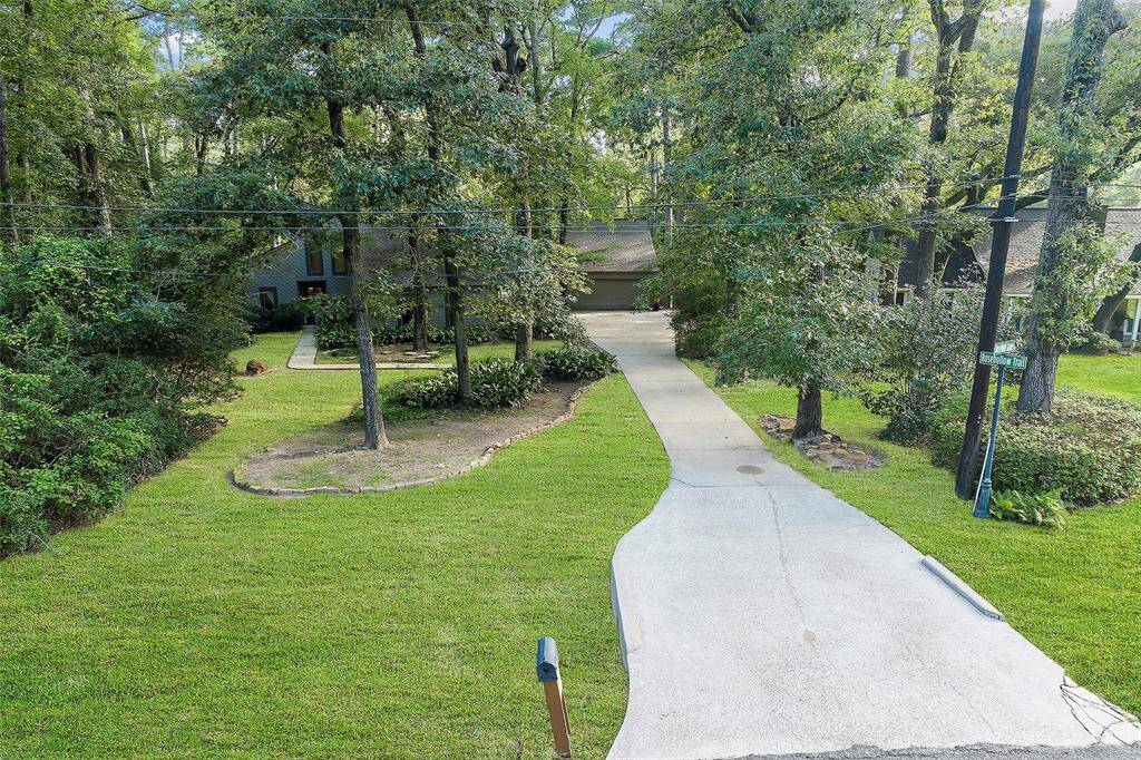 A long-extended driveway leads down to the home and offers plenty of parking for all!