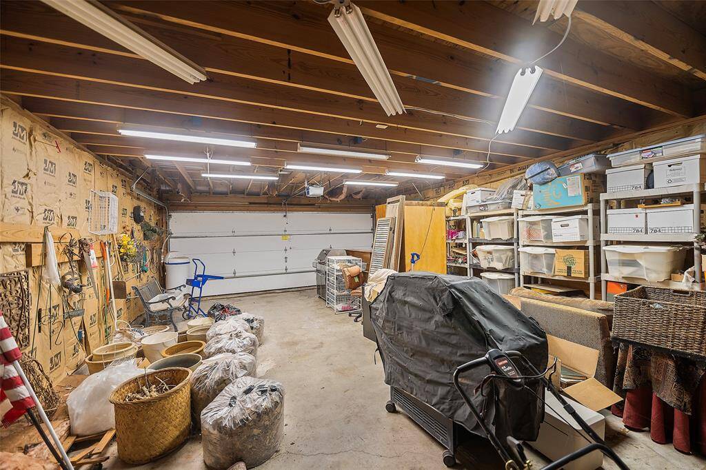 Tucked behind the other set of garage doors is this outstanding workshop area! Ideal for storage, projects and whatever tinkering you love to do!