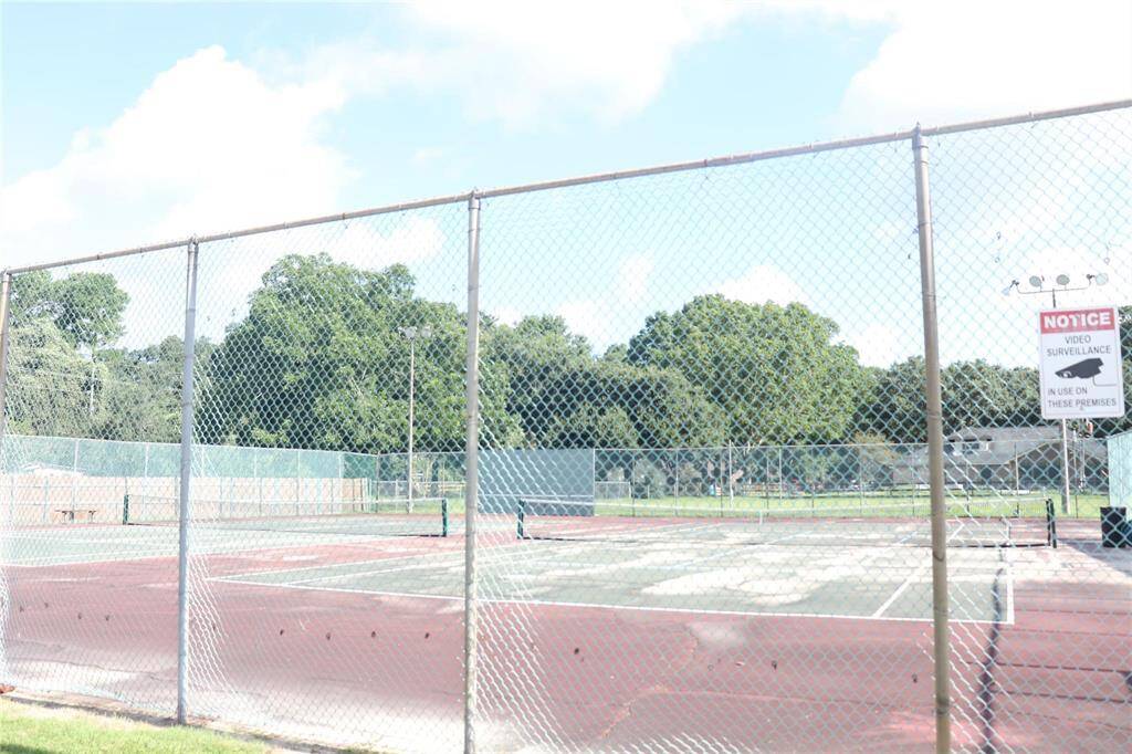 Community Tennis Courts next to the pool area
