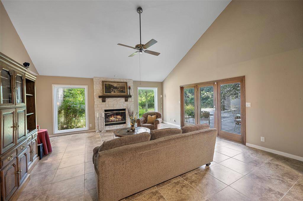 A vaulted ceiling and walls of windows with views to the outdoors, feels as if you are living in the forest, and is so peacefully relaxing!