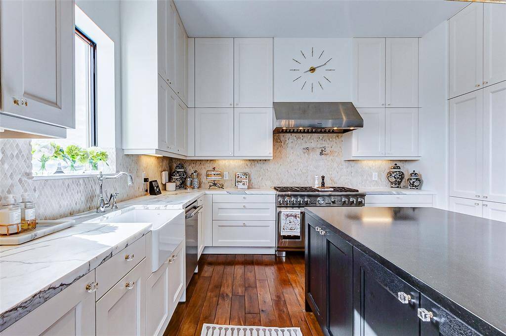 A dream kitchen with everything a cook could want. Gorgeous marble center island with breakfast bar, Eggersman cabinetry with extensive pullout drawers and organizing inserts.