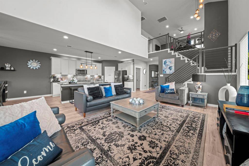 The open-concept space blends modern style with cozy charm—perfect for entertaining or relaxing in style!