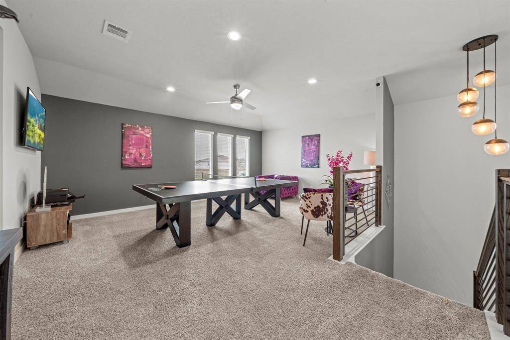 This spacious upstairs game room is the ultimate hangout zone—perfect for family fun, game nights, and kid-approved chaos!
