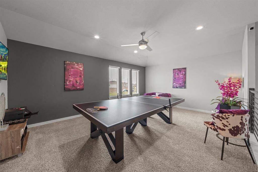 Watch TV or read a book, the game room has options for everyone!