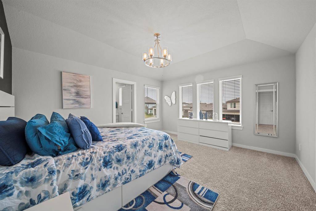 Upstairs bedroom or guest room, bright and airy.