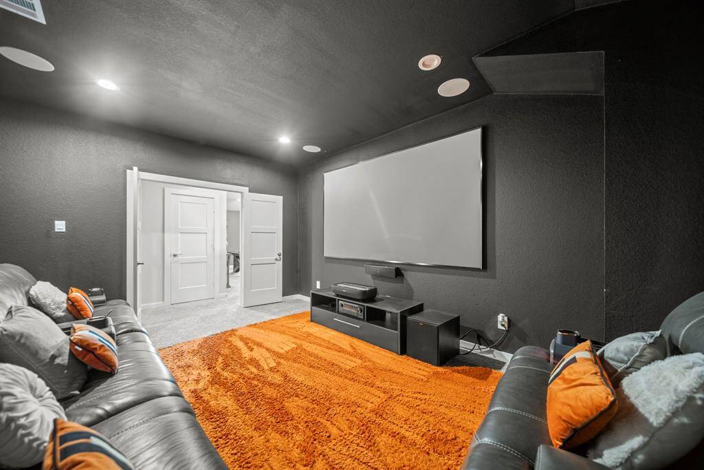 Grab the popcorn, this media room has a pop of color, perfect popcorn and drama!
