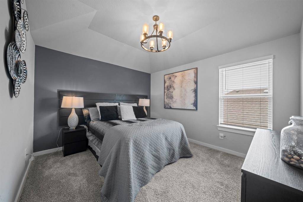 Upstairs bedroom #2 is decorated with modern flare.