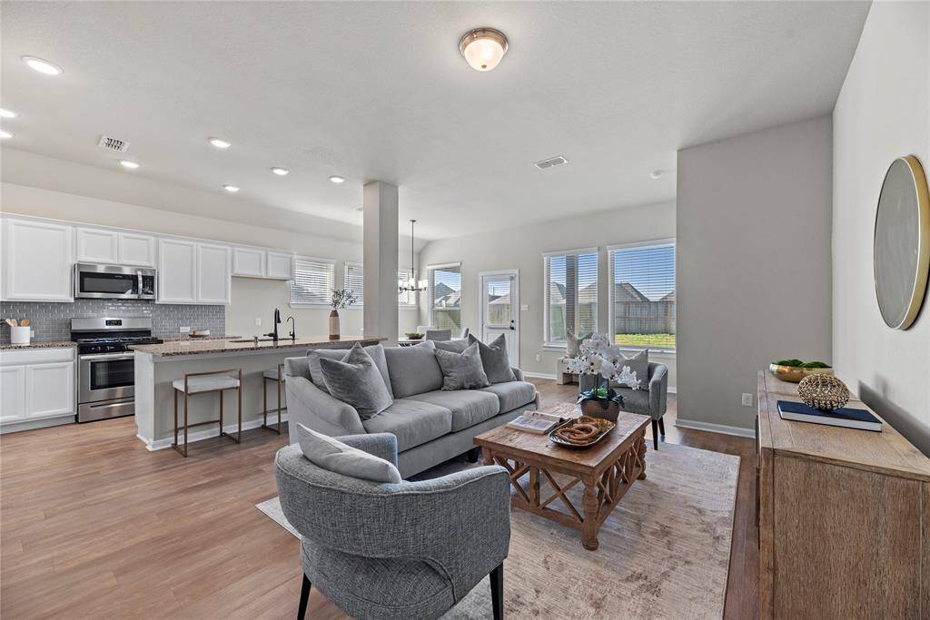 A large living area with a comfortable and inviting feel offers the perfect setting for relaxation and socializing.