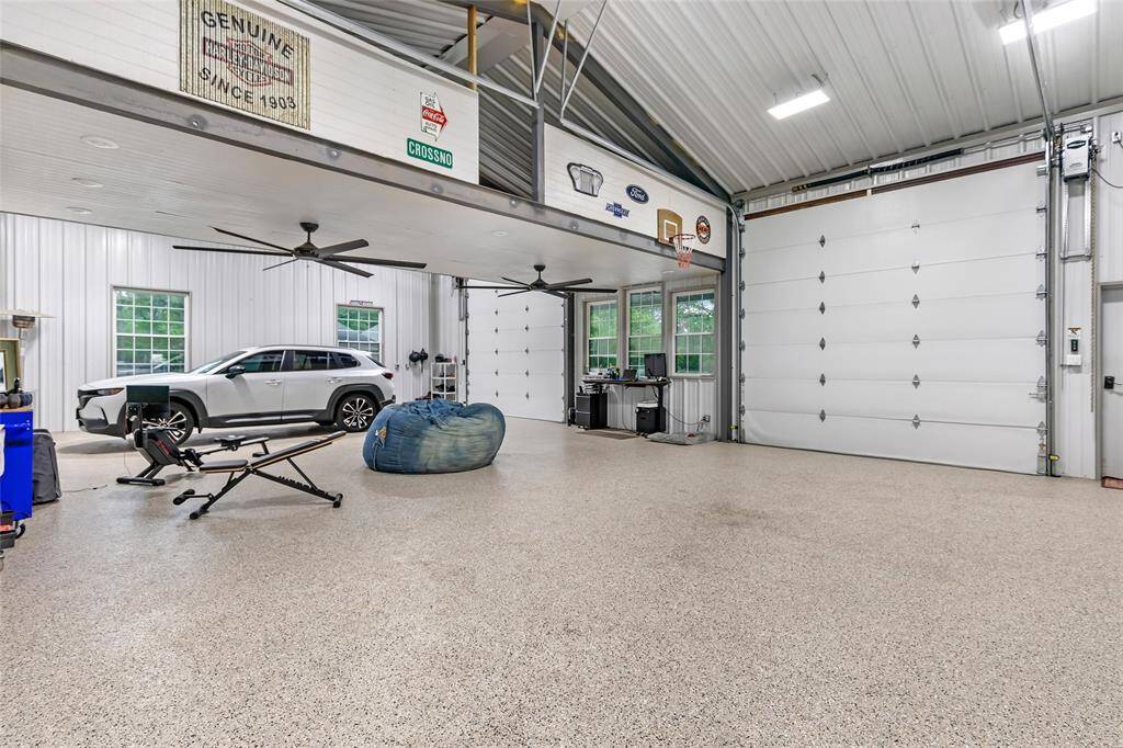 Workshop interior view. Those two double roll up doors are toward the front with the awning.