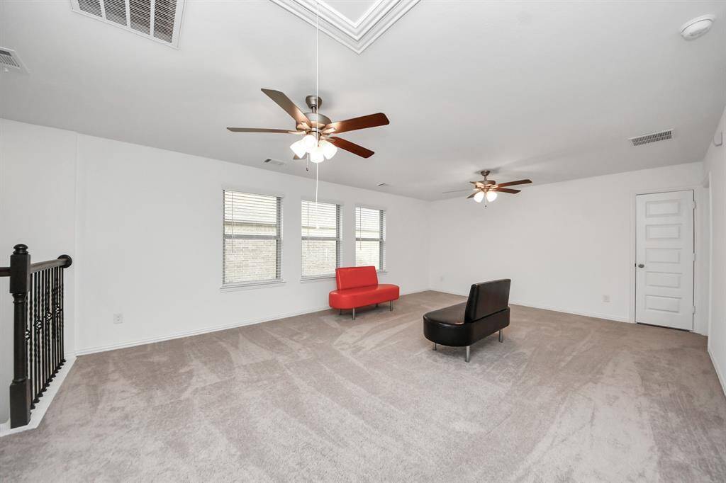 Spacious Game Room with many windows for natural light.