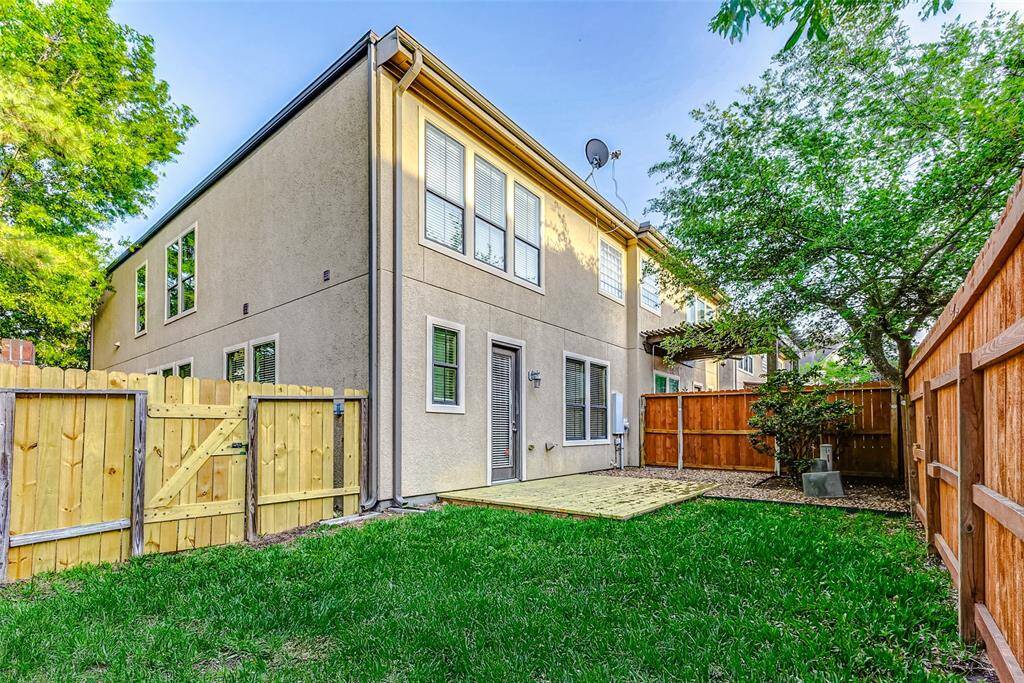 Thoughtfully designed backyard with patio & lush lawn.