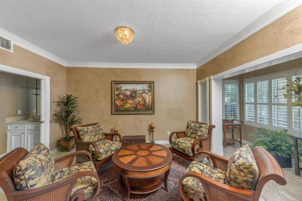 As you step into the room, the atmosphere is elegant yet welcoming, with an open and airy feel