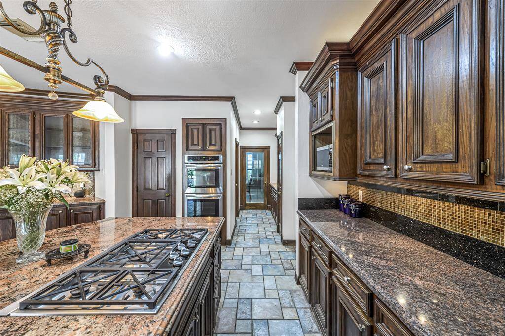 Huge island offers additional storage, a place for quick meals and plenty of prep space