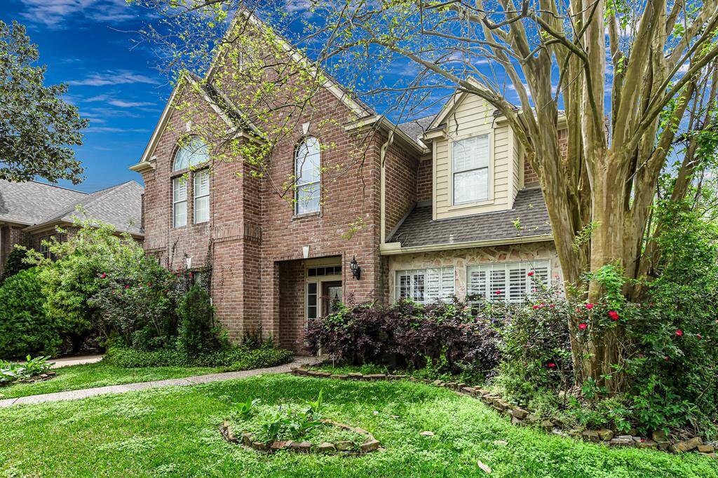 Brick and stone elevation gives this home a classic aesthetic, blending the timeless appeal of brick with the natural texture of stone