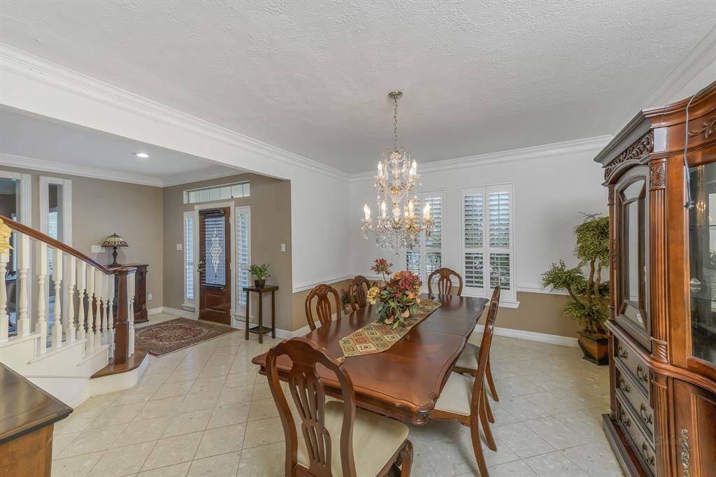 The formal living/sitting area in this home is a serene, inviting space designed to offer both comfort and sophistication