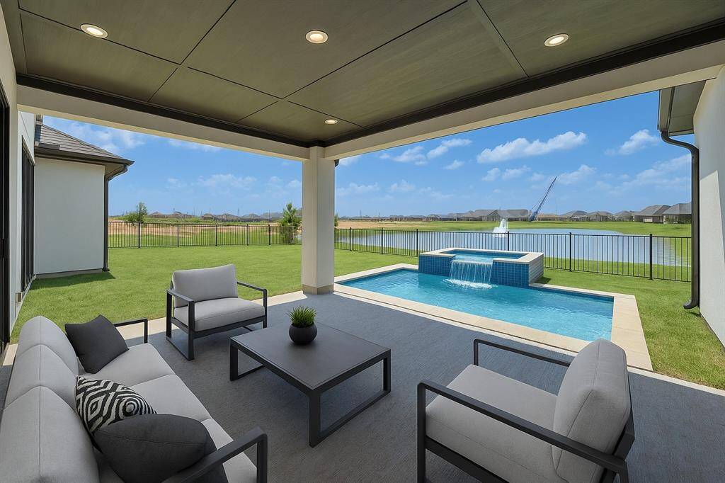 Discover this stunning modern two-story home, boasting a sleek design with expansive windows and a grand double-door entrance. The spacious driveway leads to a two-car garage, while the beautifully landscaped front yard is adorned with vibrant plants and trees.