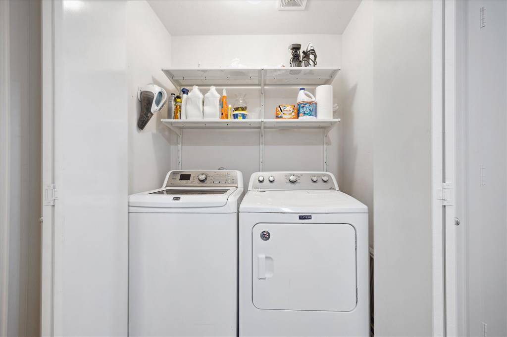 Laundry room is also on the 1st floor next to the bathroom to the left and a storage closet to the right.