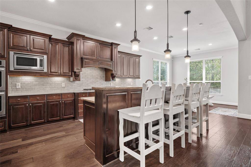 Recessed lighting, canned lighting and natural lighting. This space offers lots of luxurious touches.