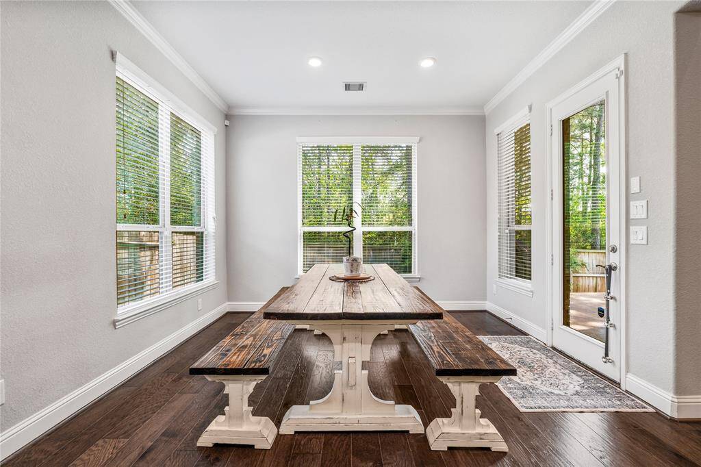 Breakfast area is incredibly spacious and offers plenty of natural light. It pens to the back patio through a glass door, enhancing indoor-outdoor flow.