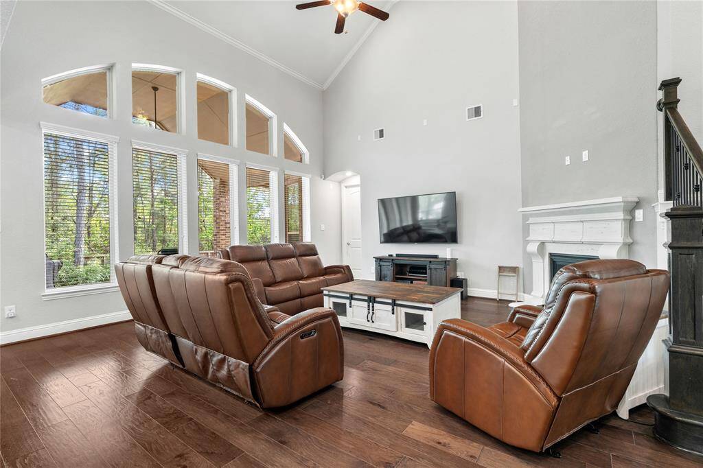 Dramatic wall of windows and arched transoms bring character and draws the eye outdoors.