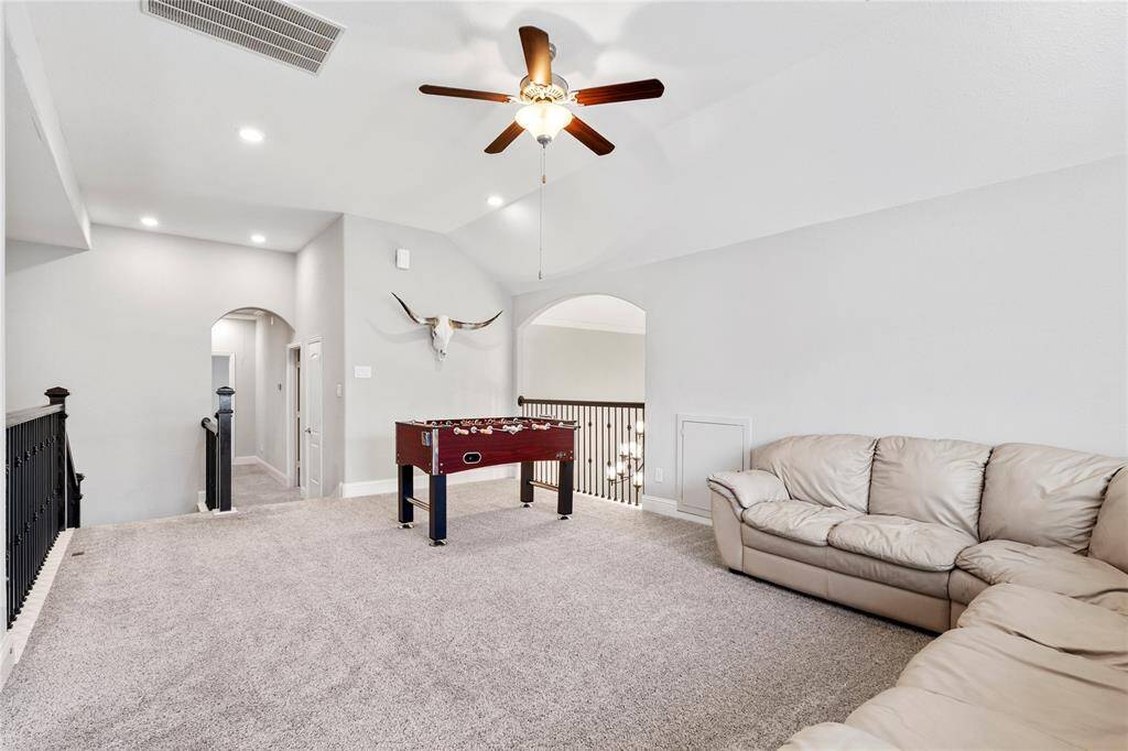 Game room leads to upstairs bedrooms.