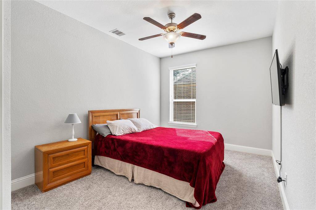 Another secondary bedroom offers plenty of space for family, friends, or guests.