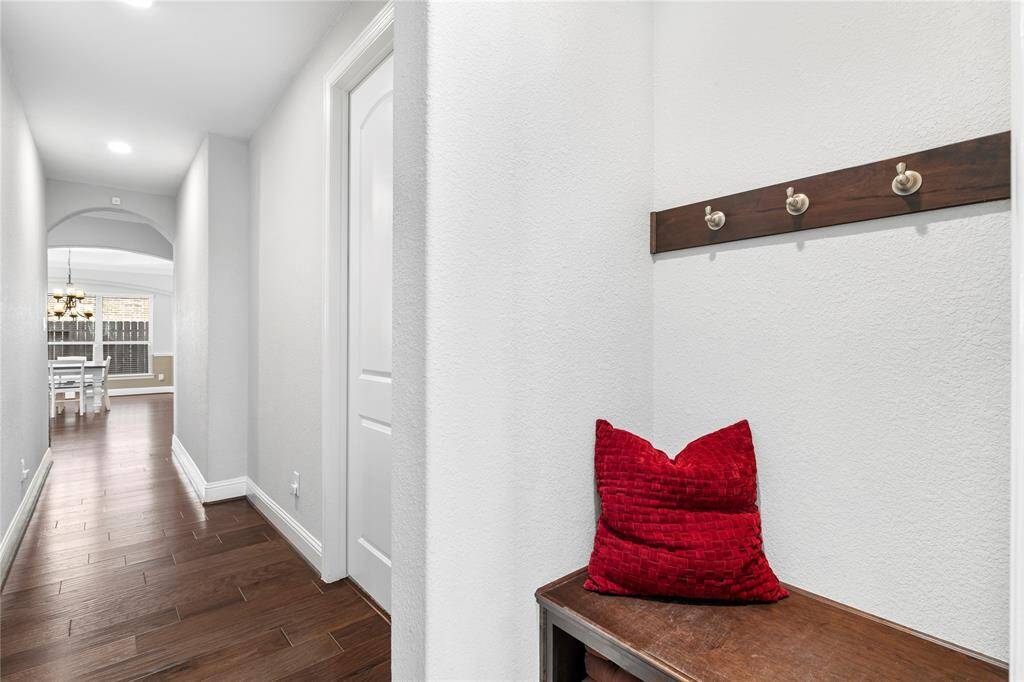 Mudroom area with hooks for bags and purses.