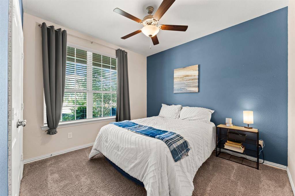 A first-floor bedroom at the front of the home offers flexible options