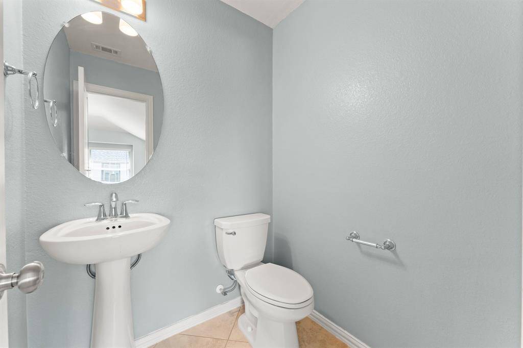 A half bath off the game room is a great feature for guests
