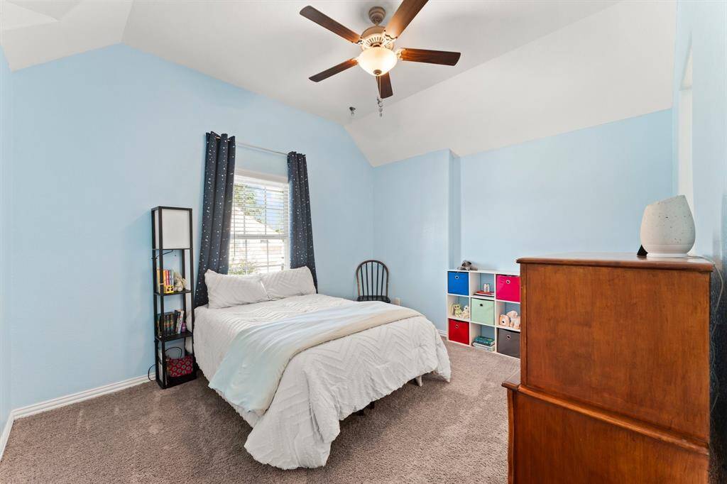 Bedroom #3 is spacious and features a ceiling fan and walk-in closet