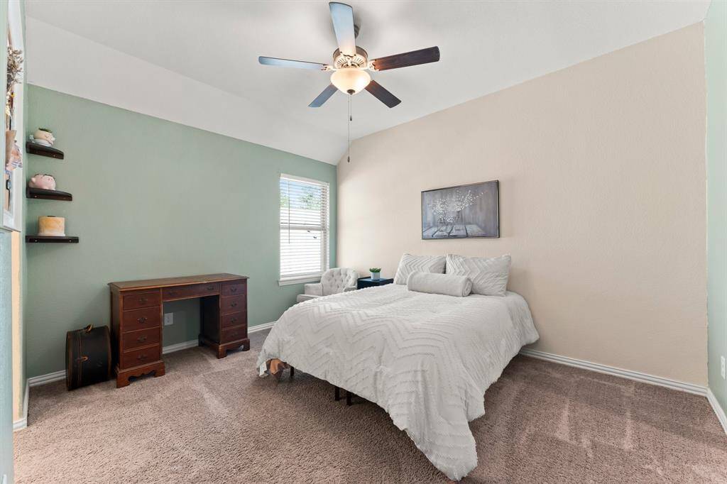 Bedroom #4 is spacious with a ceiling fan and walk-in closet
