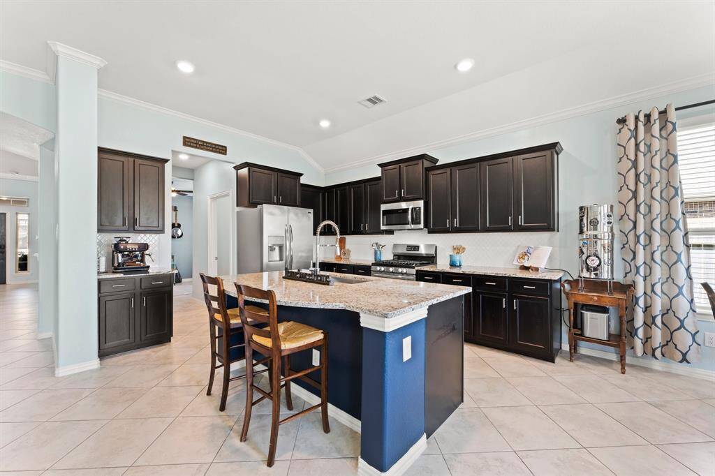 Walk in pantry and large center island will please the discerning chef