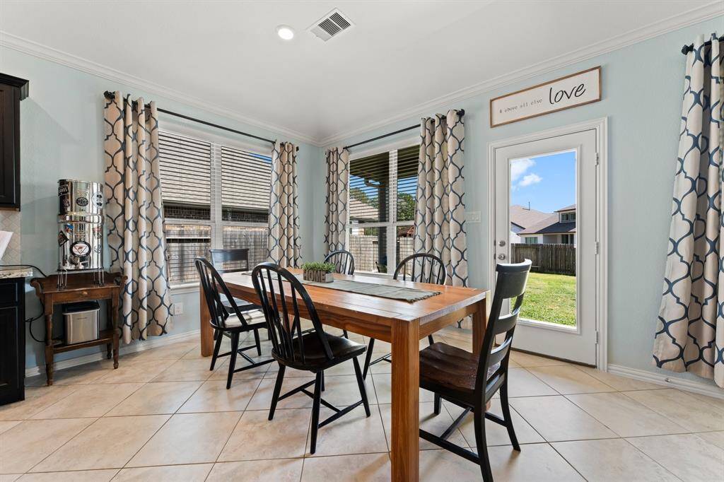 Breakfast nook with lots of natural light overlooks the sprawling back yard