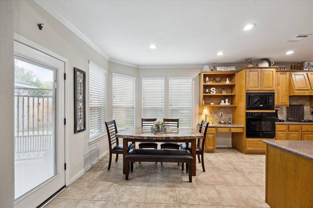 Spacious kitchen with granite countertops.