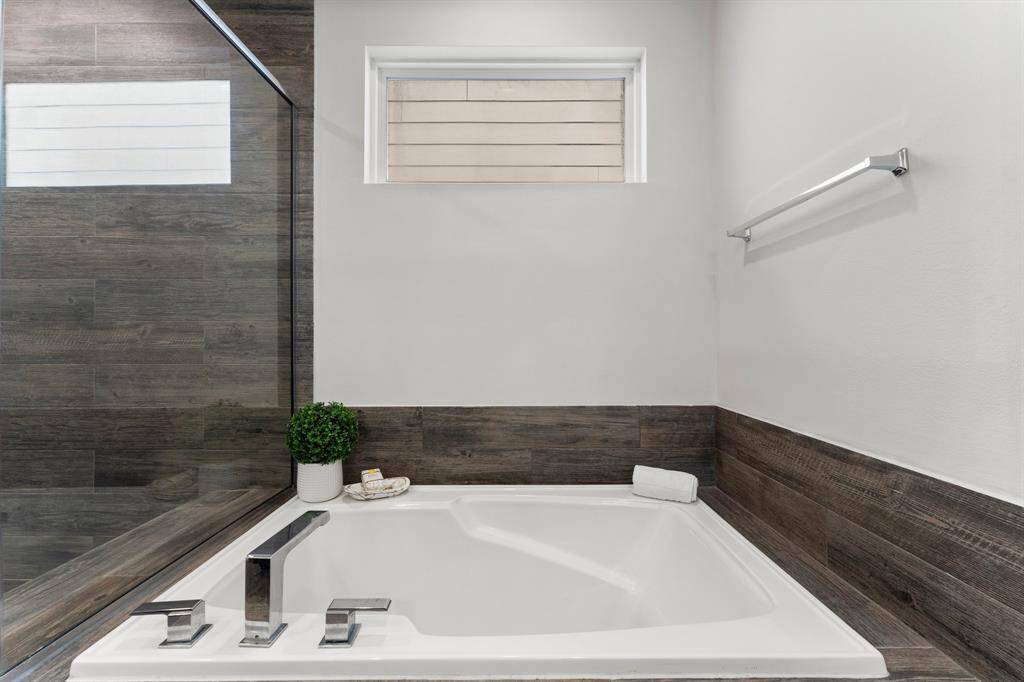 Indulge in tranquility with this bathroom's relaxing soaking tub.