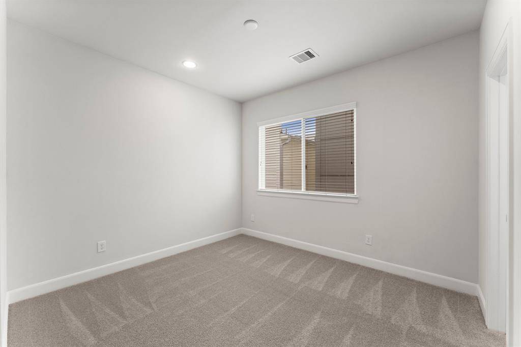 Cozy bedroom with ample natural light.