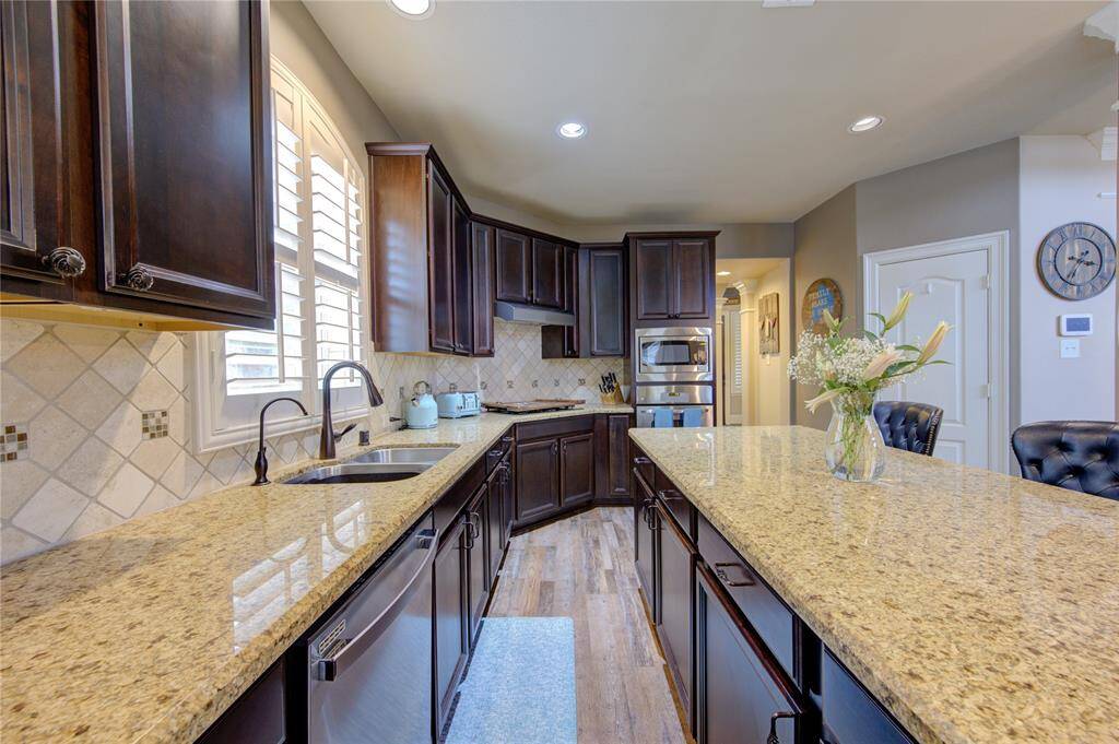 The kitchen is equipped with ample cabinets, providing plenty of storage space to keep everything organized and within reach.