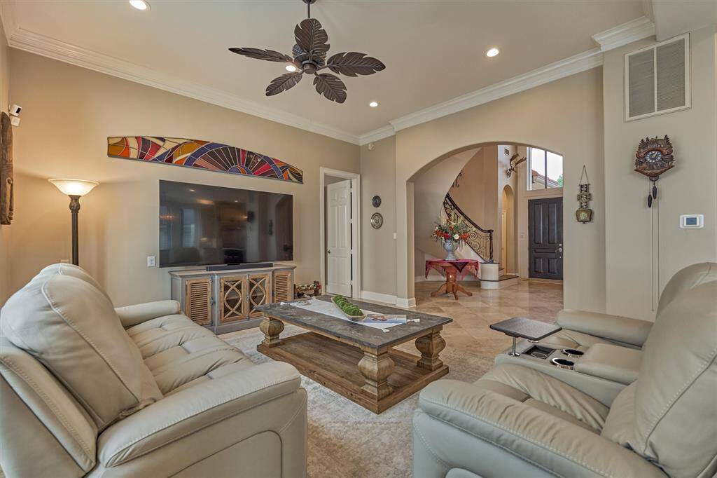 Another view of the family room with the entry foyer beyond.
