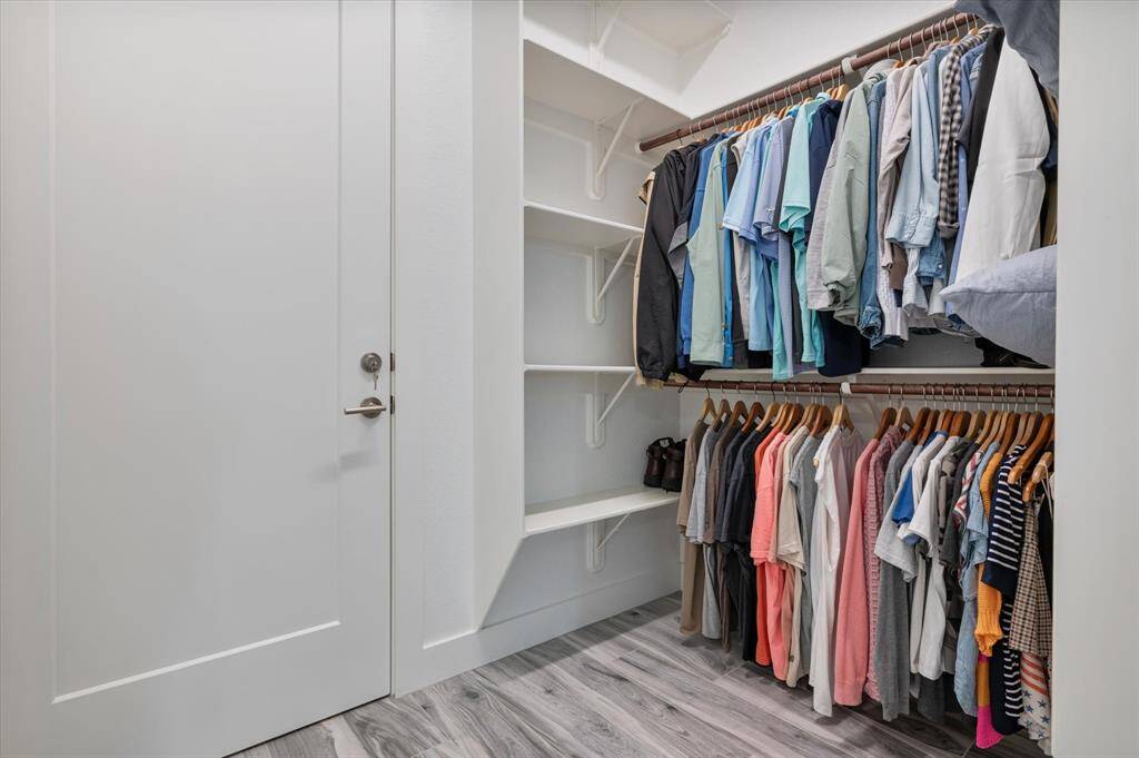 Primary closet with adjacent lockable owner's closet