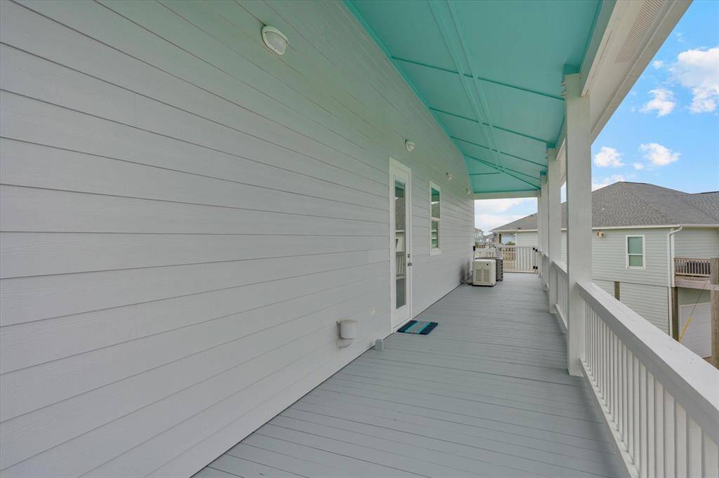 View of back door and wrap around deck