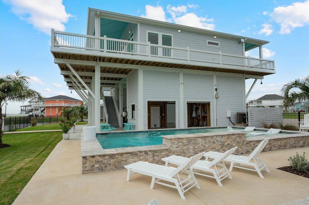 Notice the side garage doors open for entertaining