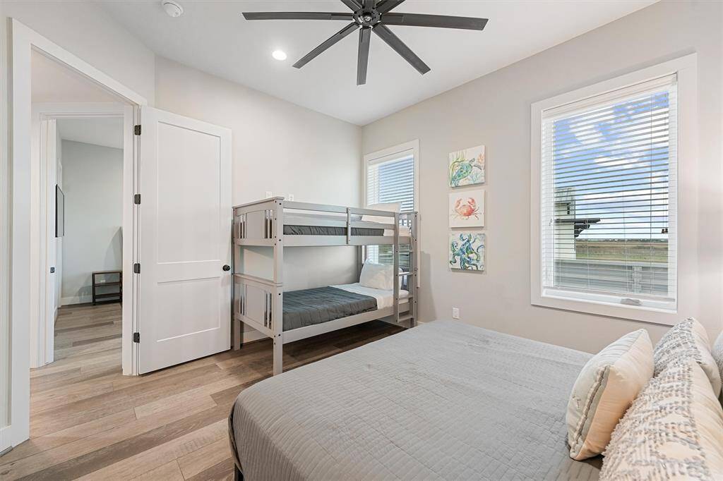 Clean and contemporary, this secondary bathroom features a sleek design with a spacious walk-in shower and plenty of counter space. A perfect blend of style and functionality.